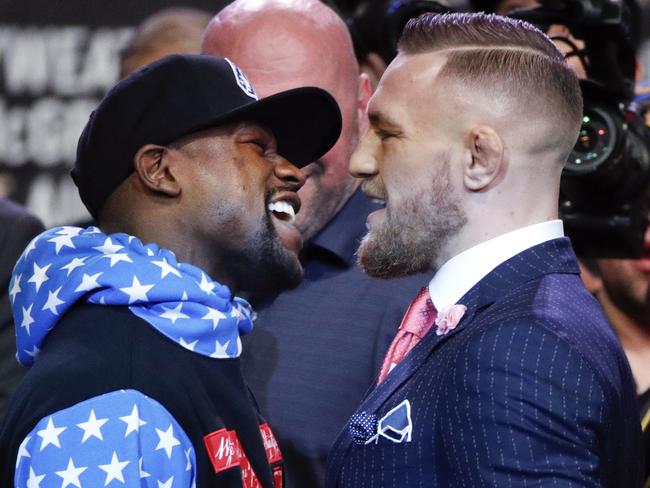 Floyd Mayweather and Conor McGregor square off. (AP Photo/Jae C. Hong)