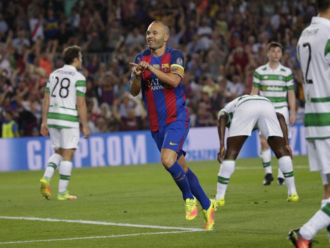 Barcelona's Andres Iniesta celebrates scoring against Celtic.