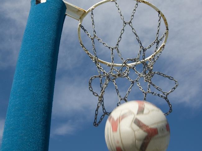 Netball ring with the ball being thrown through the hoop