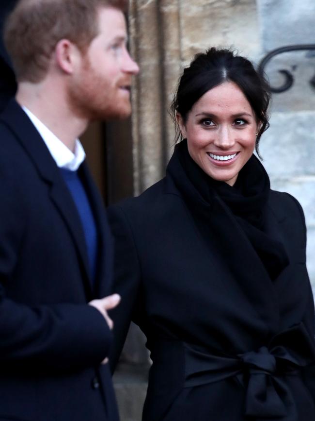 Prince Harry and his fiancee Meghan Markle depart from a walkabout at Cardiff Castle on January 18, 2018 in Cardiff, Wales. Picture: Getty