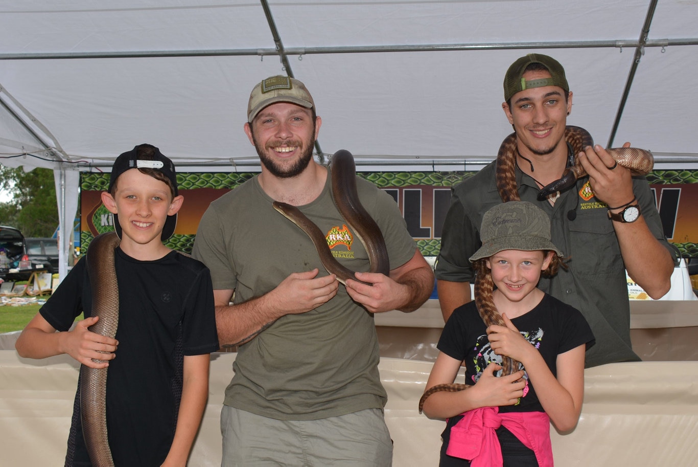 Brendan and Freya Appledorn from Kingaroy with Hugh Bason and Jaedon Lunt from Reptile Kingdom Australia at the Cooyar Show. Picture: Kate McCormack