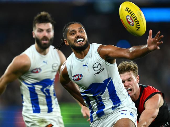 Aaron Hall of the Kangaroos is tackled during the 2023 AFL season. (Photo by Quinn Rooney/Getty Images)