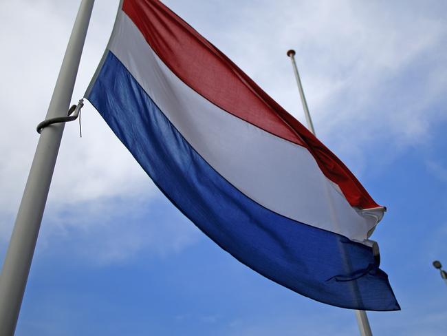 AMSTERDAM, NETHERLANDS - JULY 19: The Dutch flag flies at half mast at Schiphol Airport in memory of of Malaysia Airlines flight MH17 on July 19, 2014 in Amsterdam, Netherlands. Malaysian Airlines flight MH17 was travelling from Amsterdam to Kuala Lumpur when it crashed killing all 298 on board including 80 children. The aircraft was allegedly shot down by a missile and investigations continue over the perpetrators of the attack. (Photo by Christopher Furlong/Getty Images)