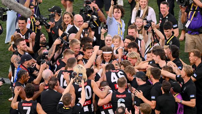 Collingwood players celebrate with Hill. Picture: Getty Images