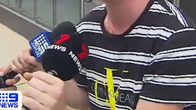 The teen grabs the reporters’ microphones. Picture: 9 News