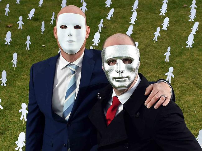 30/06/19 - Masked brothers "A" and "B" ahead of the final appeal hearing for sex predator Vivian Deboo. Surrounded by paper cut outs symbolising other victims who need help..Picture: Tom Huntley