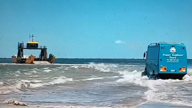 A bus drives through water at Inskip Point to reach the barge to Fraser Island in video captured by Cooloola Sails.