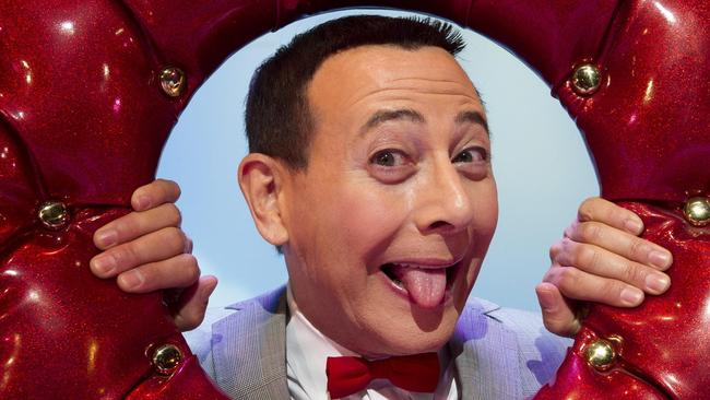 In this Friday, Oct. 29, 2010 photo, Paul Reubens, in character as Pee-wee Herman, poses on stage after a performance of 