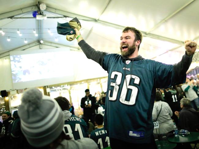 Philadelphia Eagles fans celebrate the second touchdown during the second quarter of the Super Bowl LII, played between the New England Patriots and the Philadelphia Eagles on a local bar on February 4, 2018 in Philadelphia, Pennsylvania. Picture: Getty Images