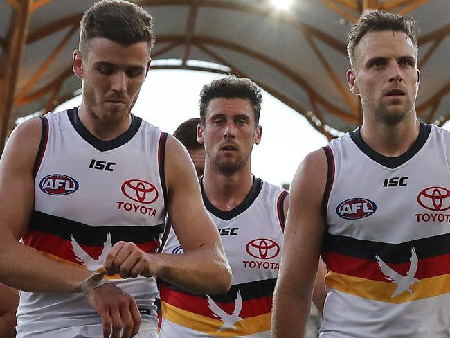 AFL Round 9. North Melbourne vs Adelaide at Metricon Stadium, Gold Coast.  01/08/2020.   The Crows trudge off Metricon Stadium after being beaten by North melbourne   . Pic: Michael Klein