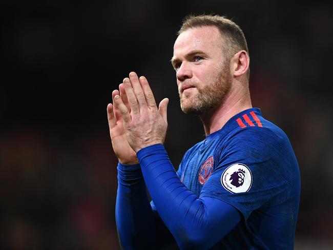Wayne Rooney of Manchester United shows appreciation.