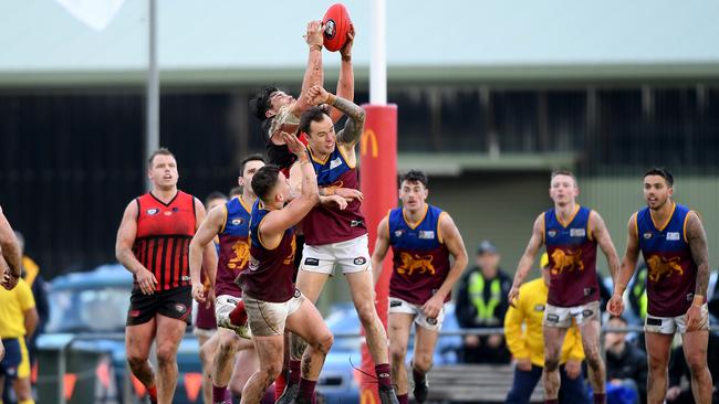 A Panton Hill players flies over the top of the pack. Picture: Andy Brownbill