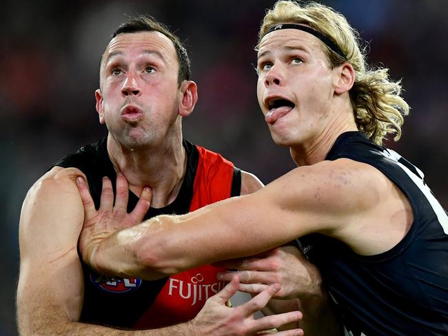 MELBOURNE, AUSTRALIA - JUNE 09: Todd Goldstein of the Bombers and Tom De Koning of the Blues compete in the ruck during the round 13 AFL match between Essendon Bombers and Carlton Blues at Melbourne Cricket Ground, on June 09, 2024, in Melbourne, Australia. (Photo by Josh Chadwick/Getty Images)