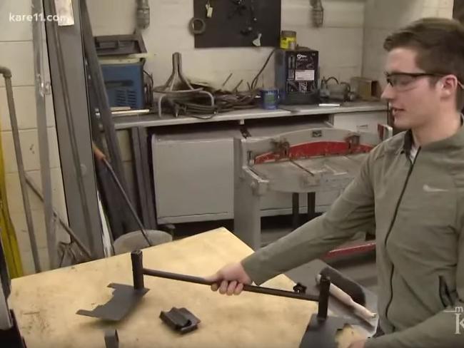 High School student Justin Rivard with his invention designed to stop school shootings. Picture: KARE