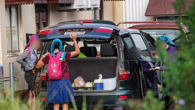 Female members arriving at Anglican Catholic Mission Community’s Kahawa cafe in Atherton. They wear headscarves, as is dictated by the cult’s strict set of rules. Picture: Brian Cassey