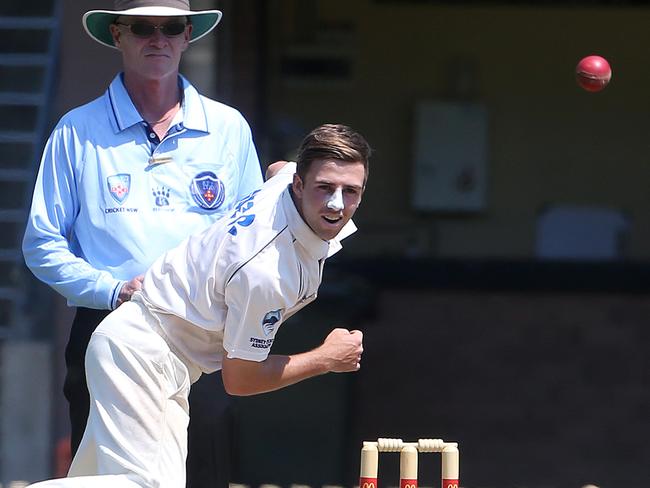 Leg-spinner Devlin Malone sends one down for Sydney University against Manly. 