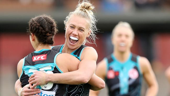 ADELAIDE, AUSTRALIA - SEPTEMBER 17: Erin Phillips of the Power hugs Julia Teakle of the Power after her goal during the 2022 S7 AFLW Round 04 match between the Port Adelaide Power and the Sydney Swans at Alberton Oval on September 17, 2022 in Adelaide, Australia. (Photo by Sarah Reed/AFL Photos via Getty Images)