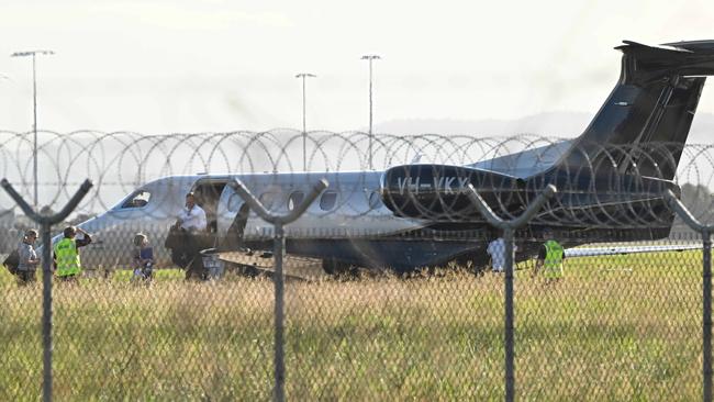 Premier Steven Miles and staff exit a private jet, VH-VKX, at the Government Air Wing at Brisbane Airport. Picture: Lyndon Mechielsen/Courier Mail