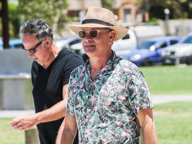 Tom Hanks strolls along the beach in Broadbeach on the Gold Coast. Picture: Nigel Hallett