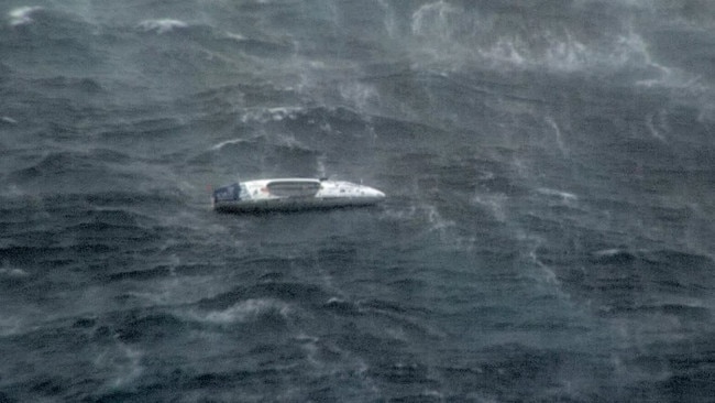 Photos of the vessel taken by the Department of Defence show the cyclonic conditions being endured by the rower.