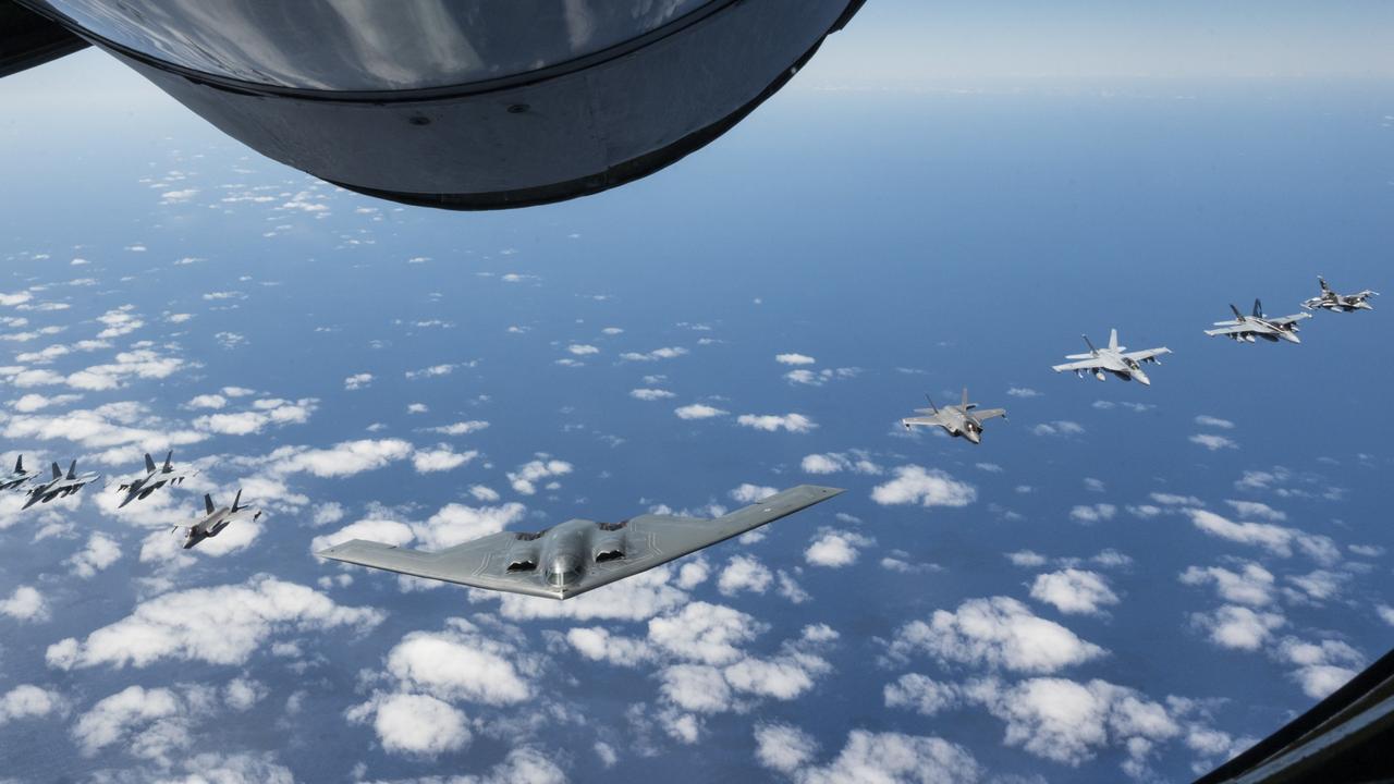 A U.S. Air Force B-2 Spirit from Whiteman Air Force Base, Mo., flies in formation with two Royal Australian Air Force F-35A Lightning IIs, two RAAF F/A-18F Super Hornets, two RAAF EA-18 Growlers, and two U.S. Air Force F-16C Aggressors, during a training mission in the Indo-Pacific region earlier this year.