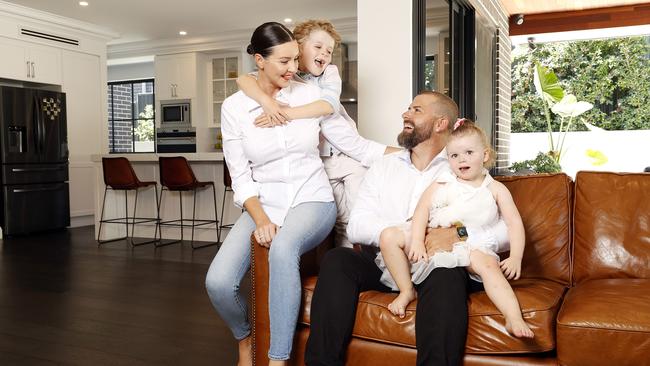 Emma and Brenden Bastian, with kids Harvey, 7 and Delilah 2, at their home in Box Hill which they are selling. Picture: Tim Hunter.