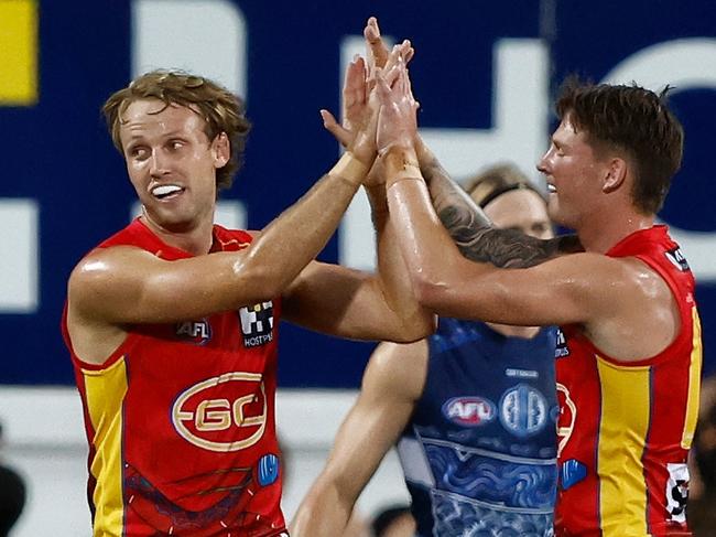 DARWIN, AUSTRALIA - MAY 16: Jack Lukosius (left) and Bailey Humphrey of the Suns celebrate during the 2024 AFL Round 10 match between The Gold Coast SUNS and The Geelong Cats at TIO Stadium on May 16, 2024 in Darwin, Australia. (Photo by Michael Willson/AFL Photos via Getty Images)