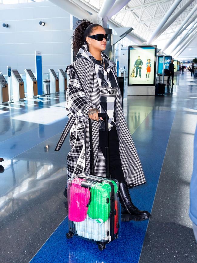 Rhianna with the Rimowa Supreme suitcase.