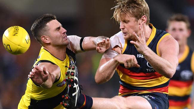 Rory Sloane gets one back on Richmond’s Jack Graham. Picture: Mark Brake/Getty Images