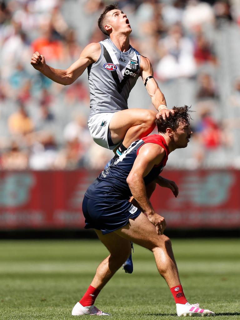 First-gamer Connor Rozee of the Power attempts a high mark over Michael Hibberd of the Demons. Picture: Michael Willson/AFL Photos/Getty Images