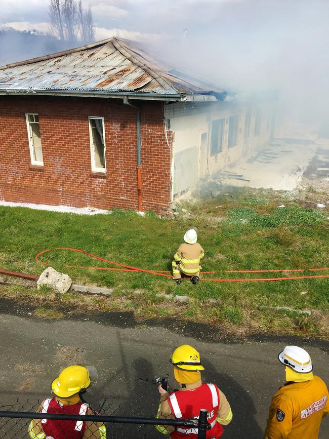 Tasmania Fire Service members at the scene of the fire at Willow Court in New Norfolk. Picture: NIKKI DAVIS-JONES