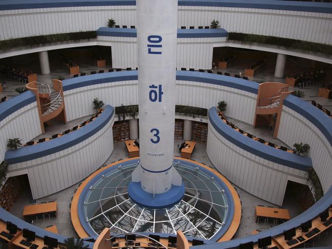 Study tables are dwarfed against the base of a model of the Unha 3, a space launch vehicle, displayed at the Sci-Tech Complex in Pyongyang. Tensions have spiked in recent weeks over North Korea’s advancing nuclear technology and missile arsenal. Picture: Wong Maye-E/AP