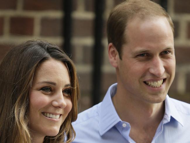 FILE - Britain's Prince William and Kate, Duchess of Cambridge hold the Prince of Cambridge, Tuesday July 23, 2013 file photo, as they pose for photographers outside St. Mary's Hospital exclusive Lindo Wing in London where the Duchess gave birth. Royal fans are ready to welcome Prince William and Kate’s second child _ a younger brother or sister to Prince George, whose birth two years ago whipped up a worldwide media frenzy. (AP Photo/Alastair Grant, File)