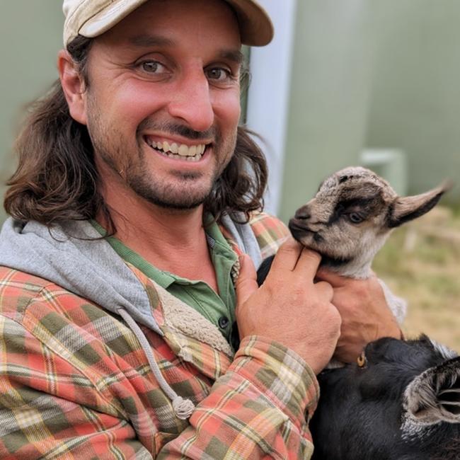 Luna Lodge owner Tom Coughlin with his charismatic pygmy goats. Picture: Supplied