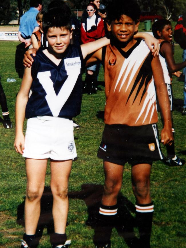 A young Cyril Rioli with Tigers skipper Trent Cotchin in 2001.