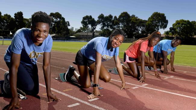 Saints Athletics Club member (L-R) Andrew Maenda, 13, KC Obi, 14, Ifeoma Achusiogu, 13, and Archie Joseph, 19 at St Peter’s College where they train. Picture: Naomi Jellicoe