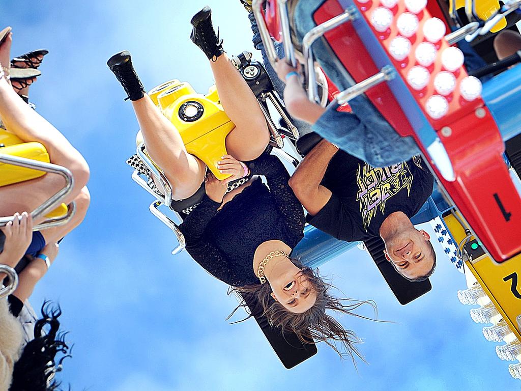 Fraser Coast Show - Jessica Sinclair and her dad Marty from Maryborough upside down on the Freak Out.Photo: Alistair Brightman / Fraser Coast Chronicle