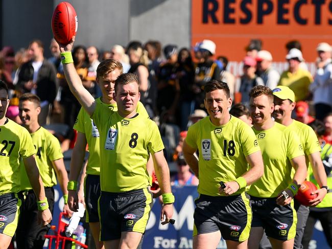 MELBOURNE, AUSTRALIA - SEPTEMBER 24: Umpires take to the field during the 2023 VFL Grand Final match between the Gold Coast SUNS and the Werribee Tigers at IKON Park on September 24, 2023 in Melbourne, Australia. (Photo by Morgan Hancock/AFL Photos via Getty Images)