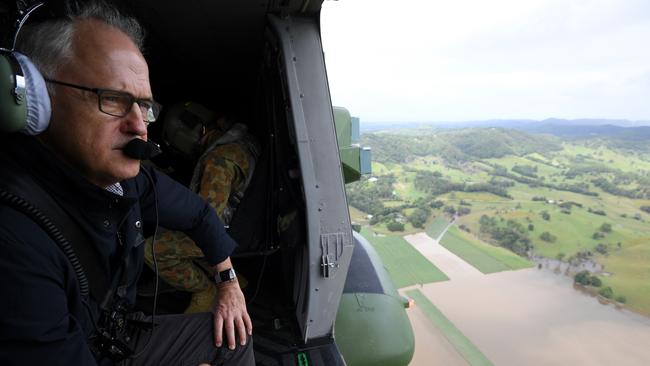 Australian Prime Minister Malcolm Turnbull surveys flood damage from an Australian Army MRH-90 helicopter, in Murwillumbah, northern NSW, Monday, April 3, 2017. (AAP Image/Dan Himbrechts) NO ARCHIVING