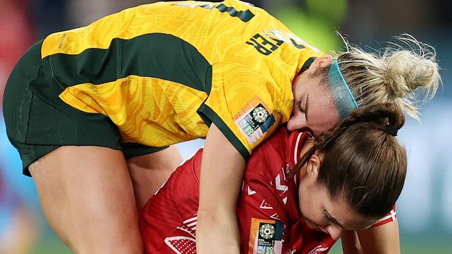 SYDNEY, AUSTRALIA - AUGUST 07: Ellie Carpenter of Australia consoles Signe Bruun of Denmark following the FIFA Women's World Cup Australia &amp; New Zealand 2023 Round of 16 match between Australia and Denmark at Stadium Australia on August 07, 2023 in Sydney, Australia. (Photo by Brendon Thorne/Getty Images )