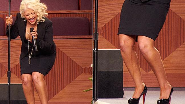 Christina Aguilera performs at the funeral oblivious to the streaks of fake tan running down her leg.