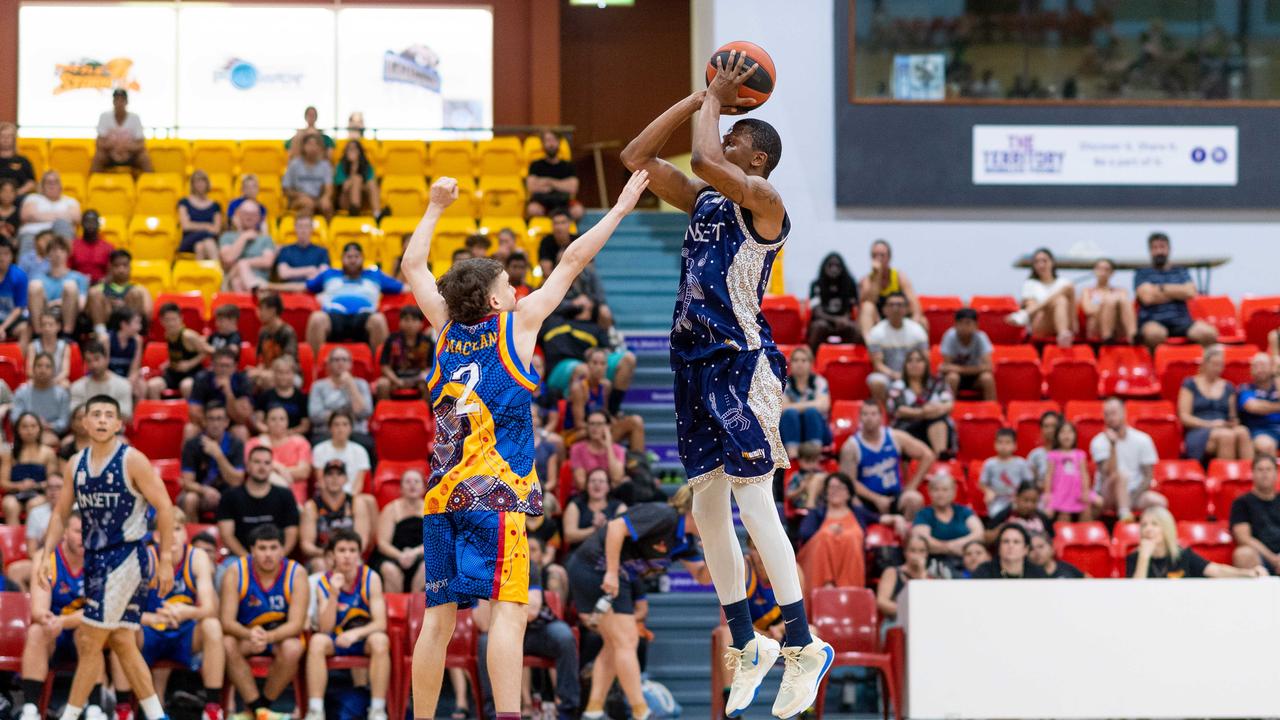 Fred Williams from Ansett on a contested three-point attempt. Darwin Basketball Men's Championship Round 20: Ansett v Tracy Village Jets. Picture: Che Chorley