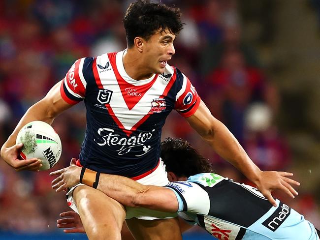 BRISBANE, AUSTRALIA - MAY 18: Joseph-AukusoÃ&#130;Â Suaalii of the Roosters is tackled during the round 11 NRL match between Cronulla Sharks and Sydney Roosters at Suncorp Stadium, on May 18, 2024, in Brisbane, Australia. (Photo by Chris Hyde/Getty Images)