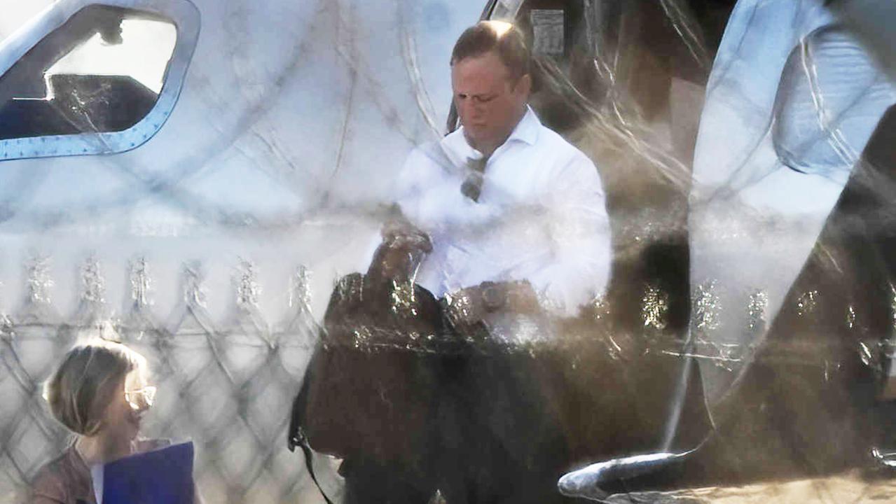 Premier Steven Miles and staff exit a private jet, VH-VKX, at the Government Air Wing, at Brisbane Airport. Picture: Lyndon Mechielsen/Courier Mail