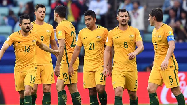 Australia's Tommy Rogic celebrates with team mates.