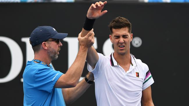 Thanasi Kokkinakis has an injury assessed during his match against Japan’s Taro Daniel at the 2019 Australian Open. Picture: AAP Image/Lukas Coch