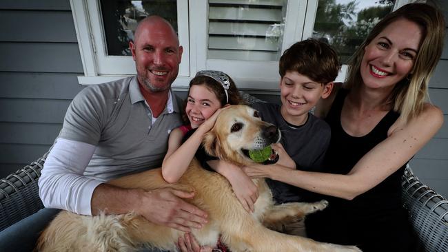 Otis the dog has loved having his family — Jarrad Pozzi, Jane Millington and kids Olive and Samson — home with him all day. Picture: Colin Murty