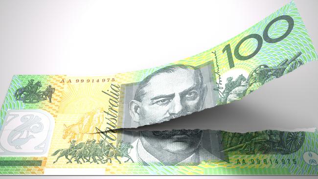 A concept picture of a regular australian one hundred dollar note tearing in two length ways on an isolated background;  money generic