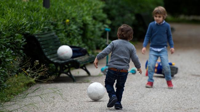 Children play with balls in a park in Seville, Spain. Picture: AFP