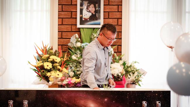 Kevin Lee says his last goodbyes at the funeral of his wife Evelin Kwok, who was killed in a car crash on Valentine’s Day. Picture: Glenn Campbell